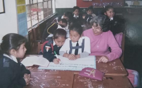 Franciscan Sr. Cristina Florez Gonzalez, right, works with children of Peruvian Air Force members in the Surco District of Lima, Peru, May 8, 2005. (Photo courtesy of Cristina Florez Gonzalez)