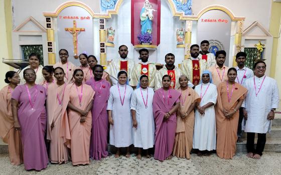 Religious communities gather for Mass on the Day of Consecrated Life at Our Lady the Healer Church in Karumandapam, Tiruchirappalli, Tamil Nadu, south India. The words written on the wall above the crucifix translate to "I am for you." (Courtesy of Robancy Helen)