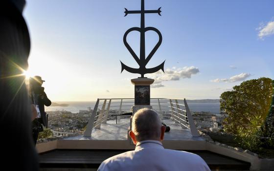 Pope Francis pauses before a memorial dedicated to sailors and migrants lost in the Mediterranean Sea in Marseille, France, Sept. 22, 2023. (CNS photo/Vatican Media)