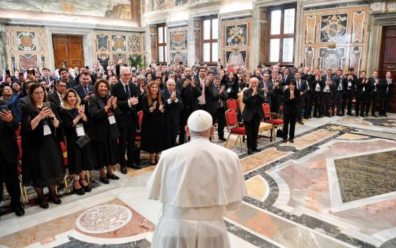 Pope Francis arrives for a meeting with the rectors of public and private universities from Latin America and the Caribbean at the Vatican Sept. 21, 2023. Responding to questions, the pope said his new document on the environment would be called "Laudate Deum" (Praise God). (CNS/Vatican Media)