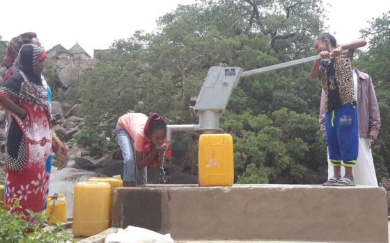 People pumping water in Ethopia