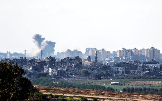 Smoke rises amid destroyed buildings in the Gaza Strip as seen from Israel's border with the Gaza Strip in southern Israel Oct. 18.