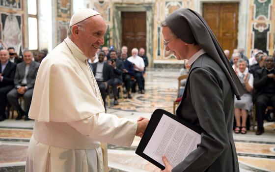 Pope Francis greets Consolata Sr. Simona Brambilla, superior general of the Consolata Missionary Sisters, during a June 5, 2017, audience with the men's and women's branches of the religious missionary congregation. (CNS/L'Osservatore Romano)