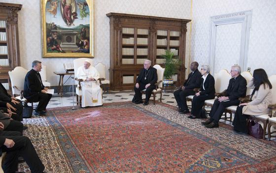 Pope Francis meets with members of the preparatory commission for the general assembly of the Synod of Bishops, March 16 at the Vatican. Pictured third from the right of Pope Francis is Mercedarian Sr. Shizue "Filo" Hirota from Tokyo. Sr. Filo Hirota speaks to NCR in Episode 2 of "The Vatican Briefing" podcast. (CNS/Vatican Media)