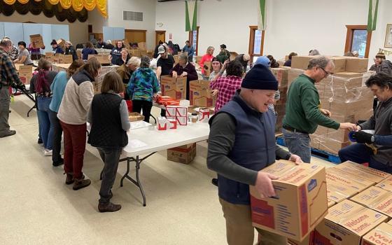 The Thanksgiving Blessing collection in Anchorage, Alaska, draws volunteers to help distribute food donations Nov. 21, 2022. The annual collaboration between local faith communities and the Food Bank of Alaska helps ensure families in the community have a holiday meal. (OSV News/Courtesy of Catholic Social Services)