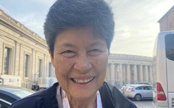 Mercy Sister Angela Perez, of Guam, poses for a photo Oct. 6 outside Paul VI Hall before the start of the third day of the Synod of Bishops in Vatican City. Seeing the pope at a roundtable, like other participants, gives her the sensation that she's witnessing the "dismantling of the hierarchical," she told Global Sisters Report. (GSR photo/Rhina Guidos)