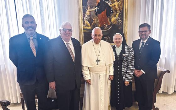 At the Vatican's Casa Santa Marta Oct. 17, from left: Matthew Myers, New Ways Ministry's staff associate; Francis DeBernardo, New Ways Ministry's executive director; Pope Francis; Loretto Sr. Jeannine Gramick, New Ways Ministry's co-founder; and Robert Shine, New Ways Ministry's associate director (Courtesy of New Ways Ministry)