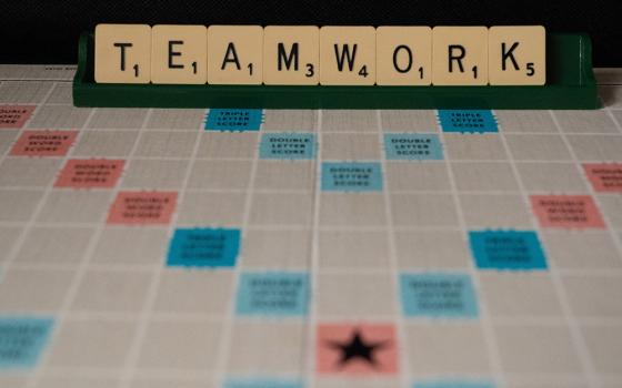 A photo illustration shows a letters board game that spells out the word "teamwork" (Unsplash/Nick Fewings)