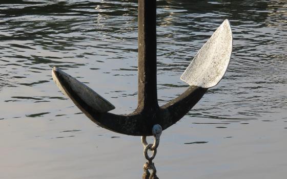 An anchor suspended above water (Pixabay/Angelika Gruber)