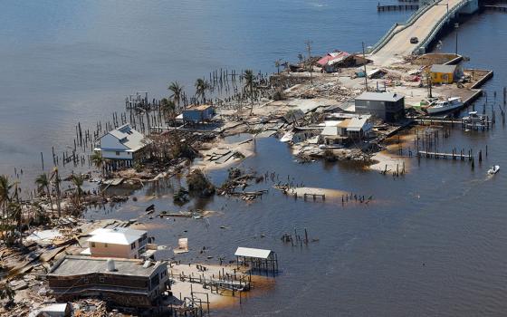 Destroyed homes and businesses on Pine Island, Florida, are seen from a U.S. Army National Guard Blackhawk helicopter Oct. 1, 2022, after Hurricane Ian caused widespread destruction. (CNS/Reuters/Kevin Fogarty)