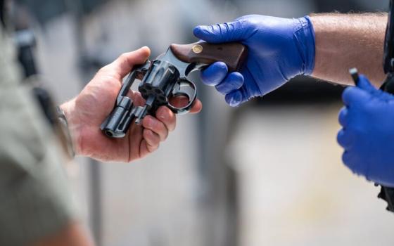 Baltimore City Police collected more than 300 guns during a gun buyback and resource event Aug. 5 at the Edmondson Village Shopping Center in West Baltimore. (OSV News/Catholic Review/Kevin J. Parks)