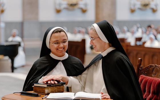 Dominican Sr. Eva Marie Gorman makes her profession of vows to Mother Anna Grace Neenan, prioress general of the Dominican Sisters of St. Cecilia Congregation, during the Mass for the Rite of Perpetual Religious Profession July 25 at the Cathedral of the Incarnation in Nashville, Tennessee. (OSV News/Tennessee Register/Rachel Lombardi)