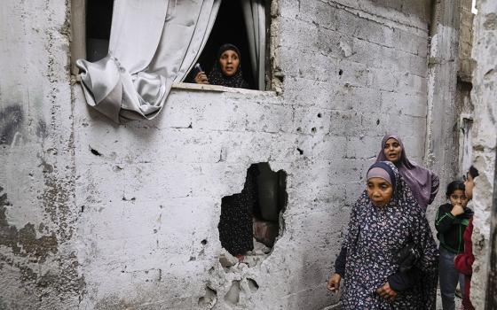 Palestinians inspect the site of an Israeli strike after a military raid in the town of Tulkarem, West Bank, Nov. 22. (AP/Majdi Mohammed)