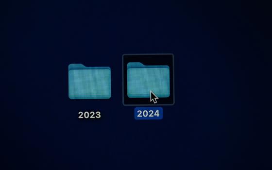 Photo illustration shows two desktop icon folders, labeled "2023" and "2024," respectively. A mouse cursor hovers over the 2024 folder. (Unsplash/Kajetan Sumila)