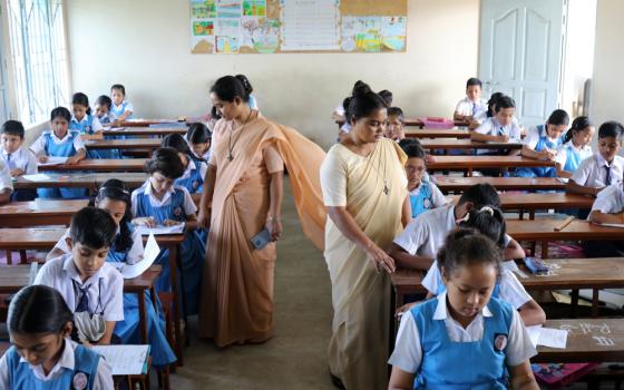 Our Lady of the Missions Sr. Pronoti Costa and Sr. Shongita Gomes, proctoring at an examination hall at St. Martha's High School at Sreemangal, Moulvibazar District, in Bangladesh. The congregation built the school and a hostel for girls of the Khasi ethnic group and for girls of workers from the area's tea gardens. (Stephan Uttom Rozario)