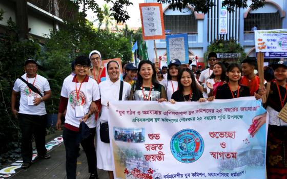 Our Lady of Sorrows Sr. Champa Adline Rozario joins young people in a peace rally.