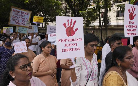 Catholic Christians hold placards and participate in a peace rally against violence in the northeastern Manipur state, in Hyderabad, India, Aug. 25, 2023. (AP/Mahesh Kumar A.)