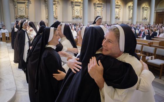 Sr. Maria Cecilia Neil embraces another member of the Dominican Sisters of St. Cecilia July 24, 2023, at the Cathedral of the Incarnation in Nashville, Tennessee, where 10 members of their congregation made their final profession of vows. (OSV News/Tennessee Register/Rick Musacchio)