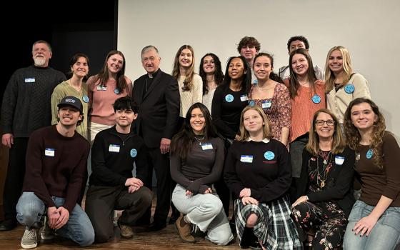 Members of the Catholic Youth Climate Summit leadership team pose for a photo with Cardinal Blase Cupich during the third annual gathering in Chicago, Feb. 25. (Courtesy of Catholic Climate Covenant)
