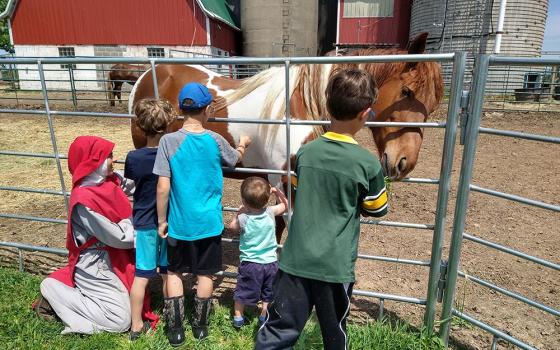 Children visit the Merciful Heart of Jesus Farm outside Marshfield, Wisconsin. The Franciscan Association of Divine Mercy formally organized in 2019, after Mother Mary Veronica Fitch received permission to pursue the new community. (Courtesy of Mary Veronica Fitch)