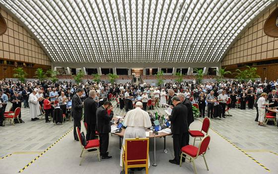 Pope Francis and members of the assembly of the Synod of Bishops begin their work with prayer Oct. 20, 2023, in the Paul VI Audience Hall at the Vatican. (CNS/Vatican Media)