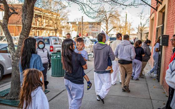 A family of migrants is dropped off by a transport contractor for the U.S. Customs and Border Protection at a shelter run by Annunciation House in downtown El Paso, Texas, Dec. 13, 2022. A state judge blocked the Texas attorney general's demands for the records of Annunciation House March 11, 2024, citing concerns the state had a "predetermined" motive to shut down the Catholic nonprofit serving migrants. (OSV News/Reuters/Ivan Pierre Aguirre)