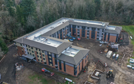 The Mercy Greenbrae project can be seen under construction on the campus of the former Marylhurst University. Through a partnership of the Sisters of the Holy Names of Jesus and Mary and Mercy Housing, 100 units of affordable housing are being built where two college dorms once stood. 