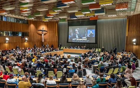 A wide view of a town hall meeting on March 13 with members of civil society during the 68th session of the Commission on the Status of Women at the United Nations in New York. On the screen is U.N. Secretary-General António Guterres. (U.N. photo/Mark Garten)