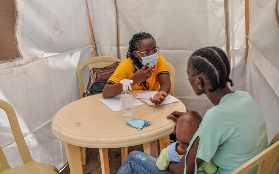 Dr. Susan Navucha, a medical officer at the DREAM Center in Lang'ata, Nairobi, Kenya, meets a client on Dec. 1, 2023. (Lourine Oluoch)