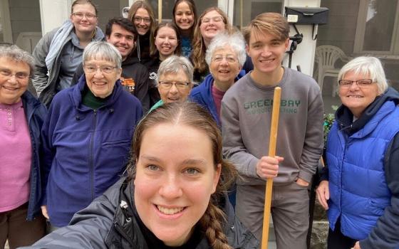 Sr. Laura Zelten smiles with her students at the University of Wisconsin-Green Bay in Green Bay, Wisconsin, during a community service event. (Courtesy of Laura Zelten)