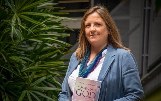 Australian Catholic University theologian Sr. Maeve Heaney, Verbum Dei, with a copy of her book, Suspended God: Music and a Theology of Doubt (Courtesy of Australian Catholic University)