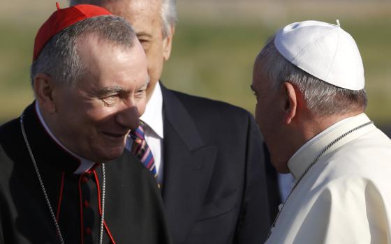 Pope Francis greets Vatican Secretary of State Monsignor Pietro Parolin