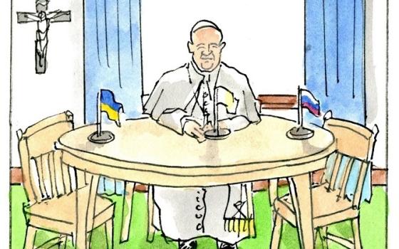 Pope Francis waits at a table with a Ukrainian flag and a Russian flag.