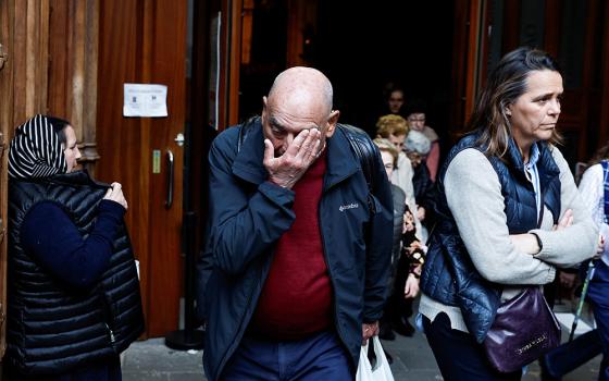 A man reacts while leaving Santiago Cathedral in Bilbao, Spain, after a Mass celebrated March 24, 2023, to recognize and apologize to victims of sexual abuse within the Catholic Church. The Mass was concelebrated by Bishop Joseba Segura of Bilbao and Fr. Josu Lopez Villalba, a victim of sexual abuse. (OSV News/Reuters/Vincent West)