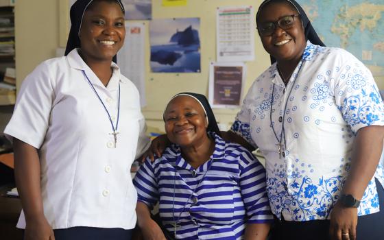 Srs. Angela Mbalu Bangura (right), Elisabeth Asare Buobi (center) and Christiana Fefegula pose for a photo at St. Joseph Primary School in Freetown, the capital of Sierra Leone. Bangura says that as a leader, she delegates duties to other sisters to help her if she cannot reach everybody. (GSR photo/Doreen Ajiambo)