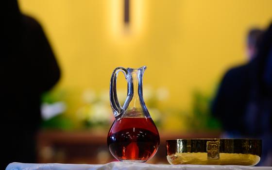 A glass cruet and ciborium, holding wine and bread that will become the body and blood of Christ, sit on a table during Mass inside the Mother of Mercy Hall at the National Shrine of Our Lady of Good Help April 28, 2019, in Champion, Wisconsin. (CNS/The Compass/Sam Lucero)