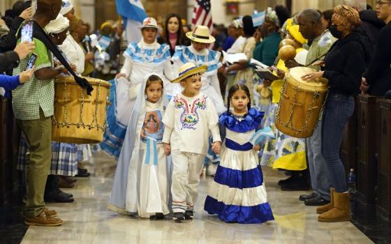 Children dressed in traditional clothing arrive in procession for a Spanish-language Mass celebrated in honor of Our Lady of Suyapa, patroness of Honduras, at St. Patrick's Cathedral in New York City Feb. 5, 2023. 