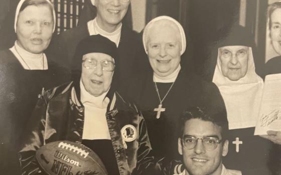 Visitation Sr. Marie Louise Kirkland holds the pigskin with Washington Redskins player Gus Frerotte on her 97th birthday in 1996. Others are (from left) Sr. Mada-anne Gell, Sr. Philomena Tisinger, Sr. Mary Berchmans Hannan and Sr. Anne Marie Di Menno. 