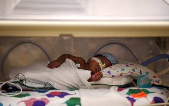 Breast milk is fed via tubes to a preterm infant at a neonatal intensive care unit in Washington, D.C., in 2017. (Grist/The Washington Post via Getty Images/Astrid Riecken))