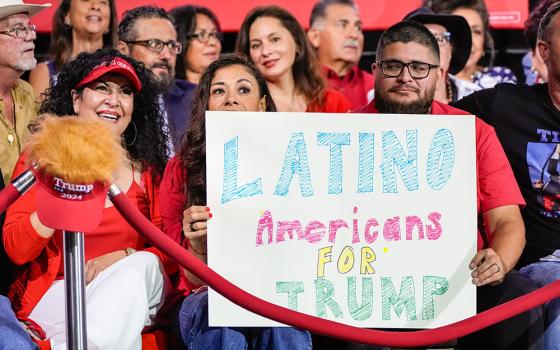 Supporters hold a sign before Republican presidential nominee former President Donald Trump arrives to speak during a campaign event Sept.12, 2024, in Tucson, Ariz. (AP/Alex Brandon, File)