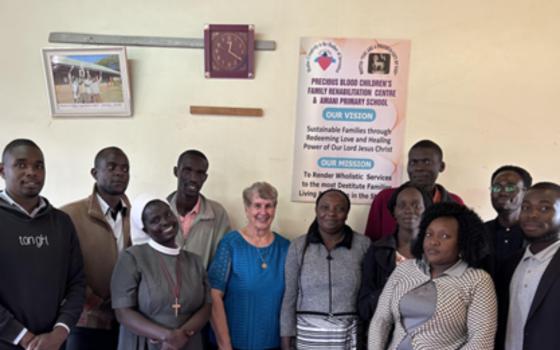 Sr. Caroljean Willie and Amani faculty