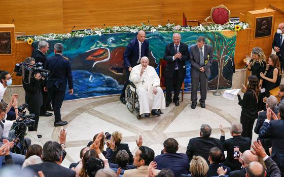 Pope Francis waves goodbye at the conclusion of a meeting of Scholas Occurentes in Rome May 19, 2022. The event was for the launch of the "Laudato Si' School," a yearlong project of Scholas young people to develop projects to promote protection of the environment. (CNS/Paul Haring)