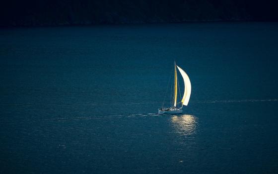 Sailboat on dark blue waters (Unsplash/Vidar Nordli Mathisen)