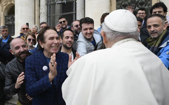 Pope Francis greets members of Mosaiko, a Rome organization for LGBT Christians, at the end of his weekly general audience in St. Peter's Square at the Vatican May 17, 2023. (CNS/Vatican Media)