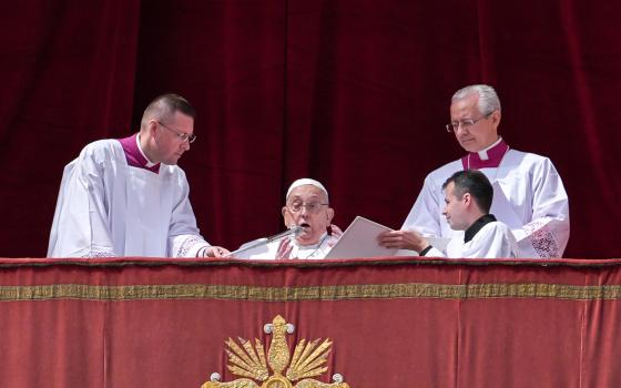 Pope Francis greets the crowd before delivering his Easter blessing "urbi et orbi" (to the city and the world) from the central balcony of St. Peter's Basilica at the Vatican April 20, 2025. (CNS photo/Lola Gomez)