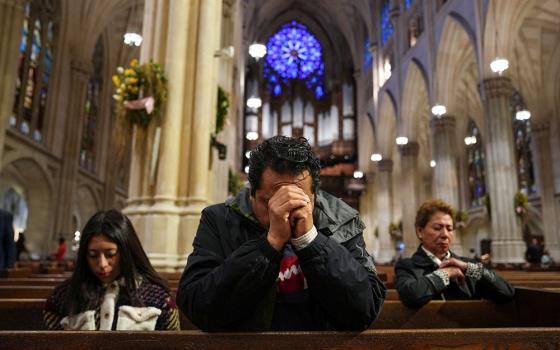 A man prays at St. Patrick's Cathedral in New York City April 21, 2025, after the death of Pope Francis was announced by the Vatican. Pope Francis, formerly Argentine Cardinal Jorge Mario Bergoglio, died April 21 at age 88. (OSV News/Reuters/Adam Gray)