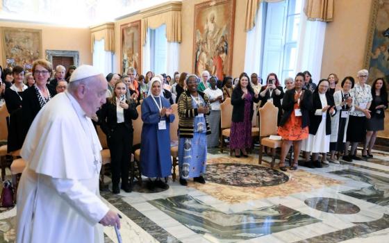 Pope Francis arrives for a meeting with women participating in or assisting the Synod of Bishops in the Apostolic Palace at the Vatican Oct. 19, 2024. The synod on synodality, for the first time in history, lay people, including about 50 women, were included as voting members. (CNS/Vatican Media)