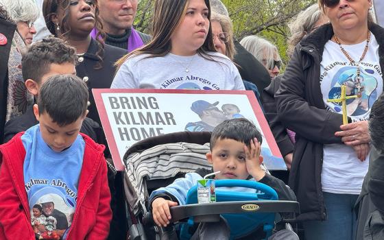 Jennifer Vasquez Sura, middle, holds a sign calling for the liberation of her husband Kilmar Abrego Garcia, during a Holy Week vigil near the White House on April 14 in Washington. Catholics joined the interfaith gathering to pray for the liberation of Abrego and other immigrants sent to a prison in El Salvador. (GSR photo/Rhina Guidos)