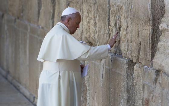 Pope Francis prays in front of the Western Wall, in Jerusalem's Old City May 26, 2014. (AP Photo/Oded Balilty, File)