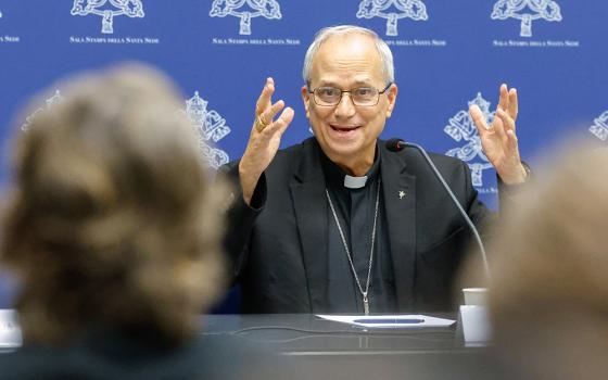 Then-Cardinal Robert Prevost replies to a question from a journalist during a briefing about the assembly of the Synod of Bishops at the Vatican Oct. 25, 2023. (CNS/Lola Gomez)